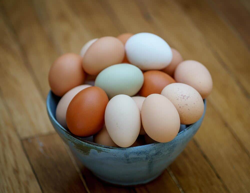 Eggs in a blue bowl on the table