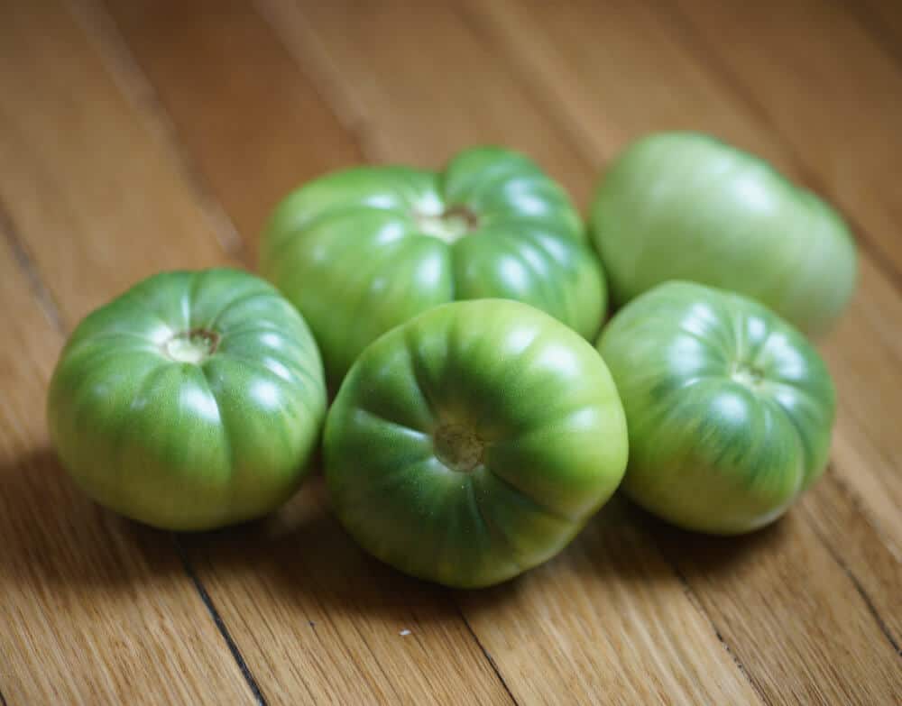 Green tomatoes on a table