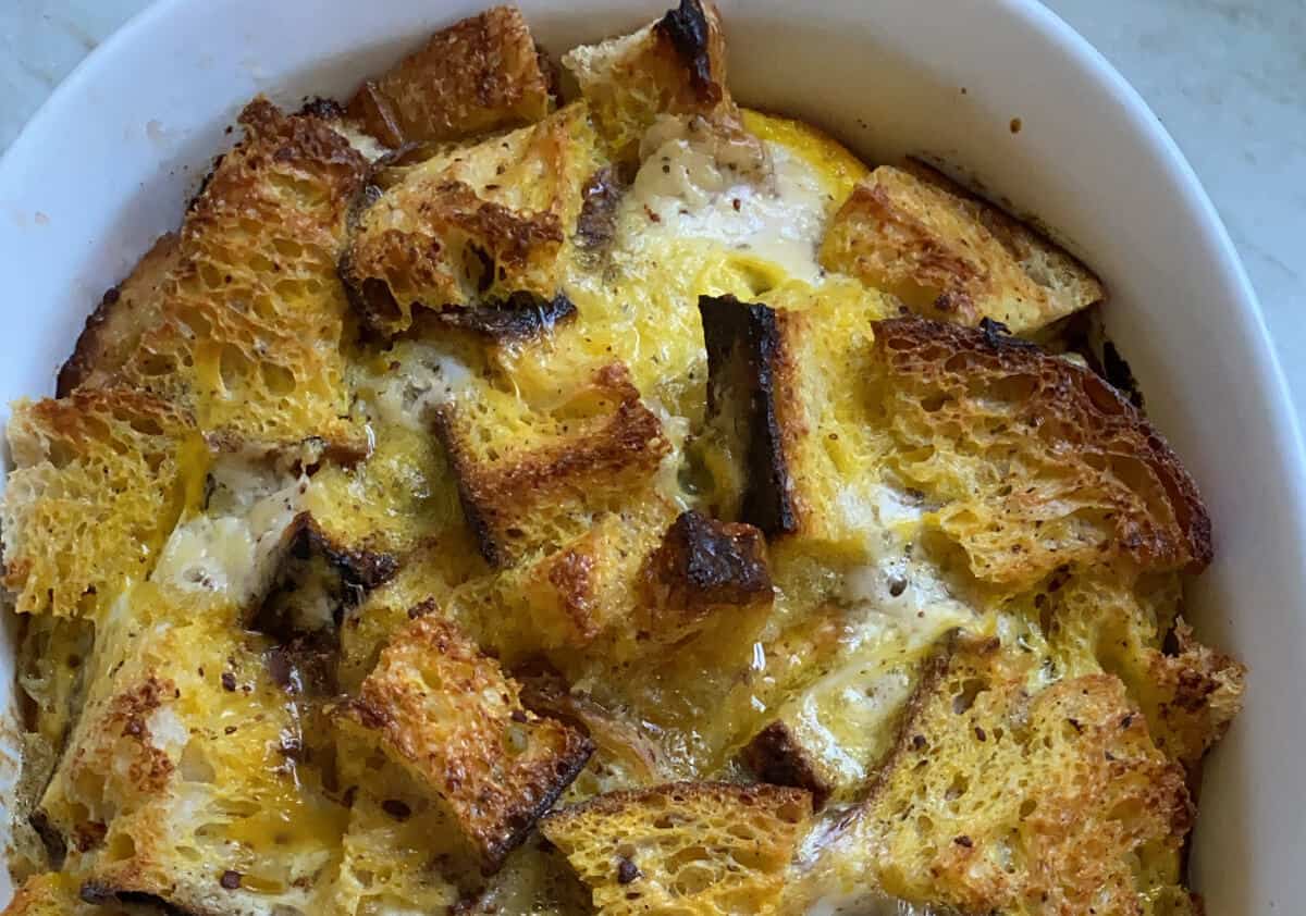 Prepared baked french toast in a white serving dish