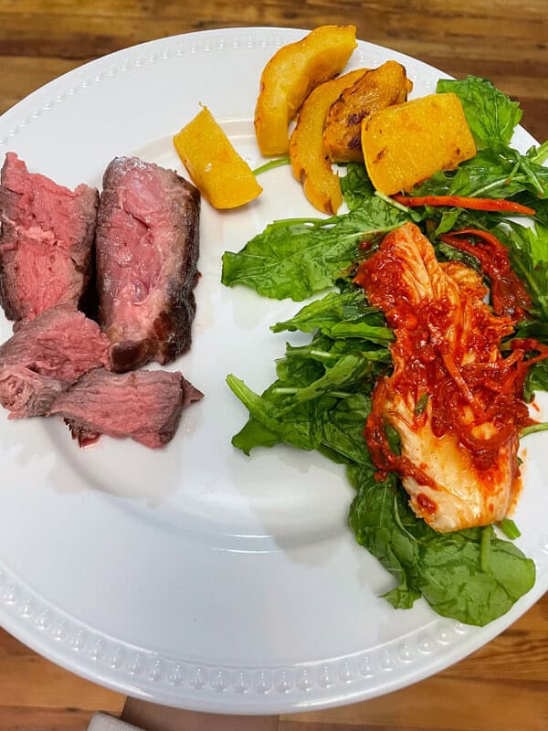 msfm-oven-baked-chuck-roast-recipe-meal Oven Baked Chuck Roast sliced and on a plate with a salad and veggies